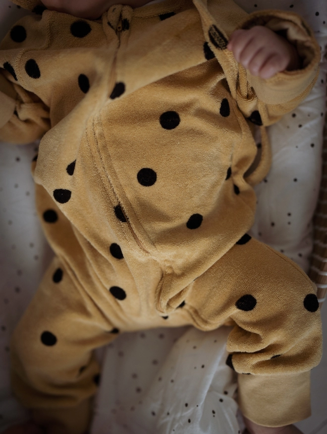 Close up of the Another Fox Camel Terry Towel Spot Baby Sleepsuit.