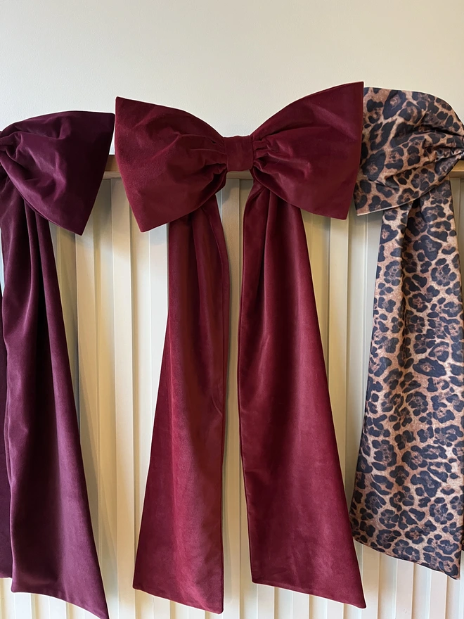 Wine Red Bow flanked by Burgundy Bow left and Leopard Print right 