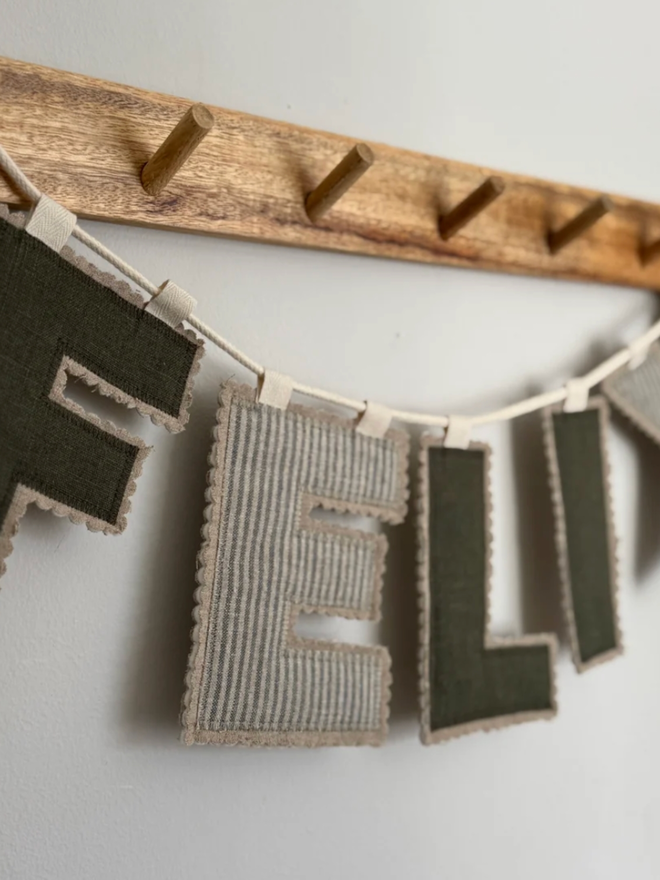 Linen Name Garland. A garland reading FELIX.
