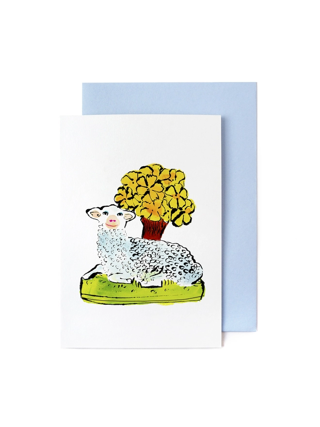 Greeting card with blue envelope featuring a pen and ink illustration of a lamb and flowers on grass on Staffordshire antique ceramic.