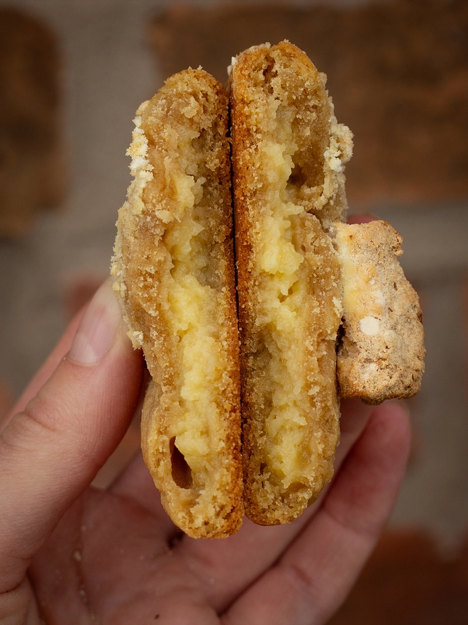 Picture showing the inside of a Lemon Curd Cookie, lemon yellow against a buttery cookie crumb