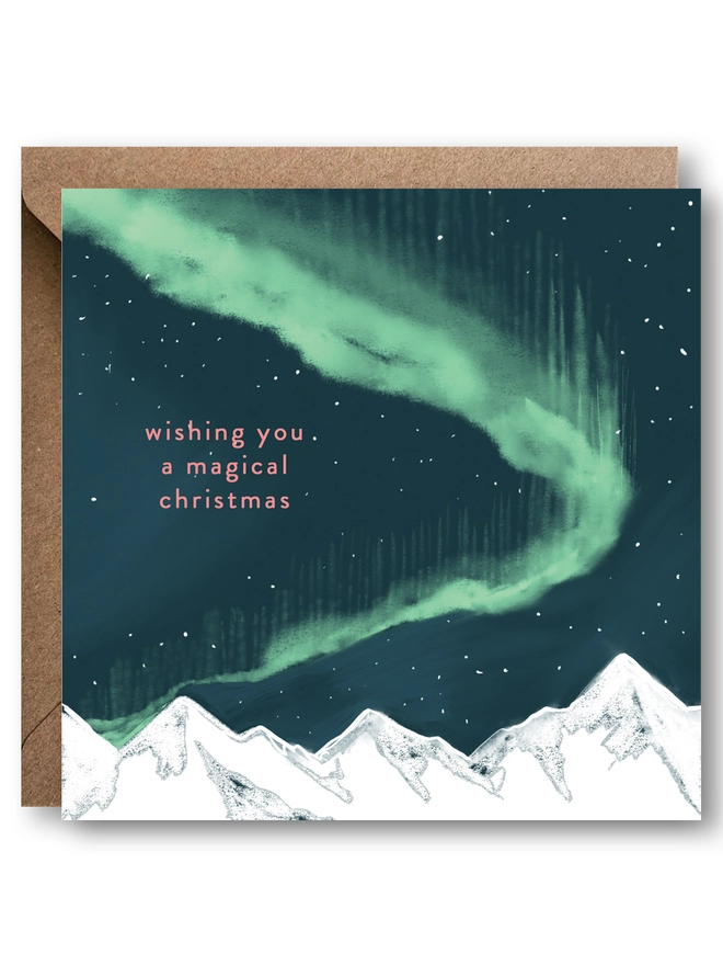 Northern Lights and mountains Christmas card with message that reads 'wishing you a magical christmas'