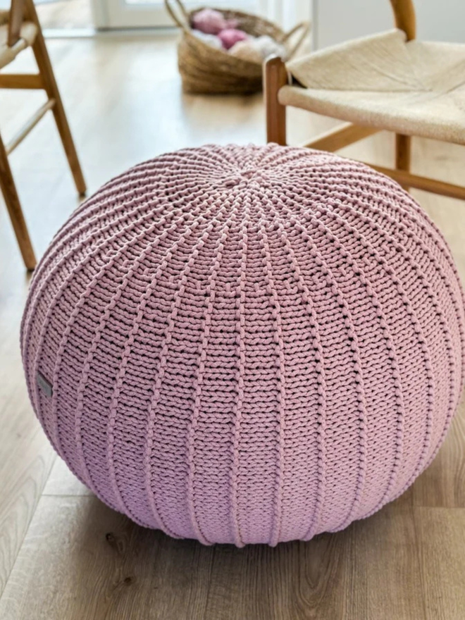 Zuri House. Large powder pink knitted pouffe.