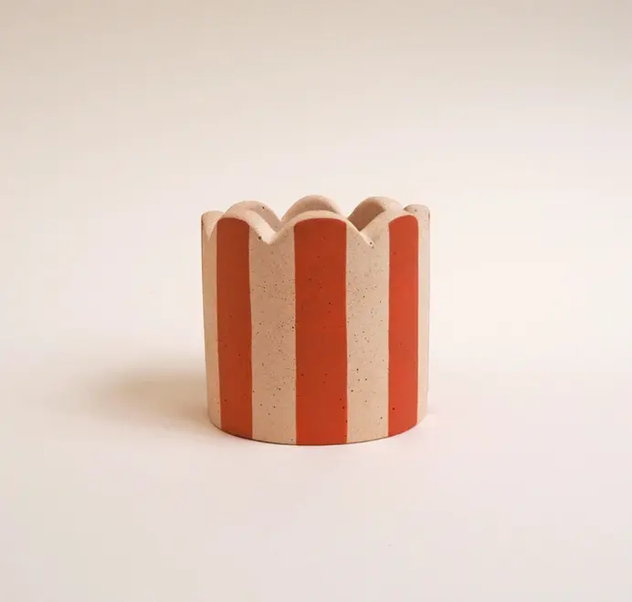 Small Scalloped Stripy Plant Pot. white ceramic pot with vertical coloured stripes set against a plain light background.