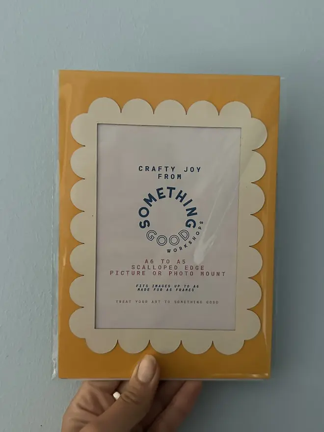 Scallop Edged A5 / A4 photo mount. yellow and white mount photographed against grey background.