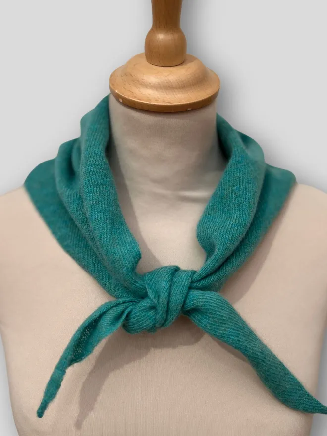 Penny Grace Knitwear Jade Triangle Scarf on mannequin