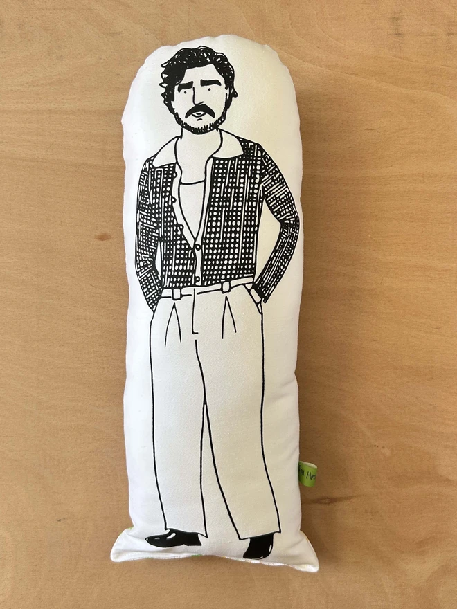 Black and white cushion featuring an illustration of Pedro Pascal.