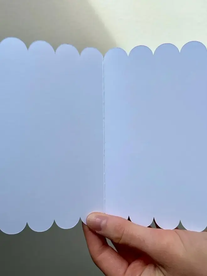 happy 1st birthday illustrated giraffe card. scallop edged card open to show blank inside.