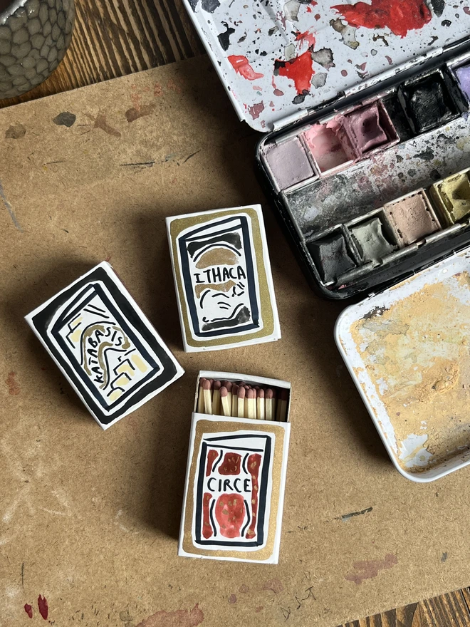 Circle, Ithaka, katabasis book covers hand painted onto mini matchboxes personalised