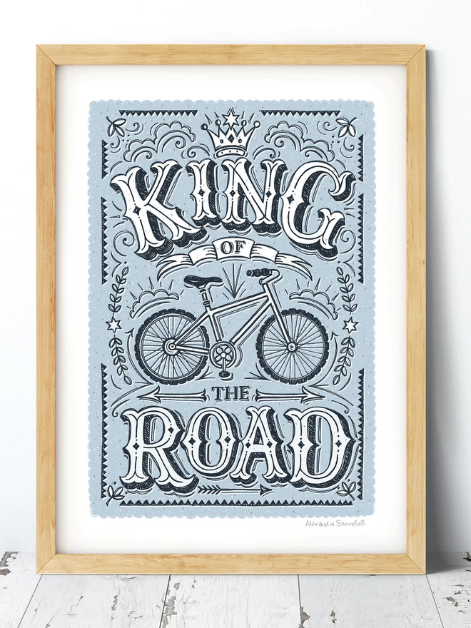 blue king of the road cycling print in wood frame