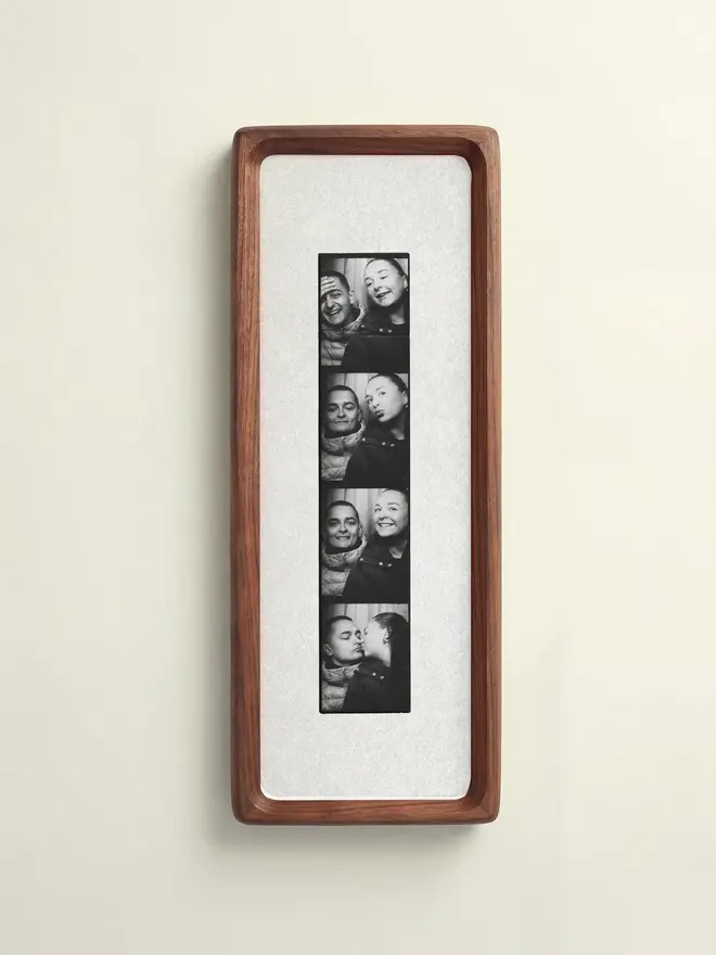 Natural White Mounted Photobooth Solid Wood Frame, hanging on a white wall. 