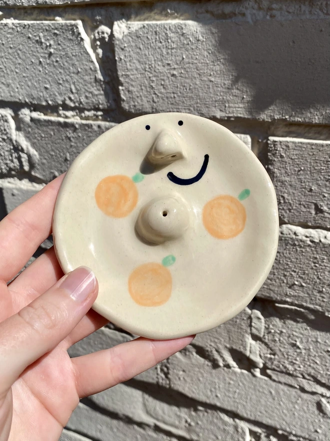 orange incense dish