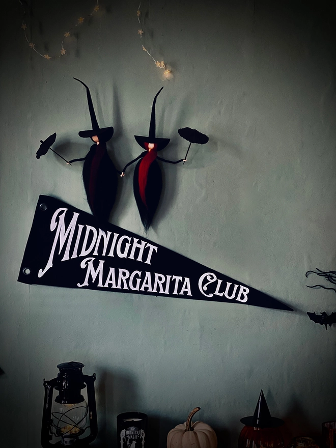 Black flag white writting Midnight Margarita Club Practical Magic