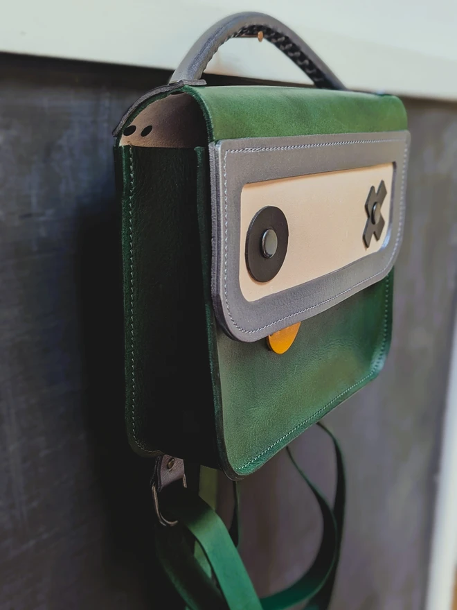 Green Robot backpack, side view.