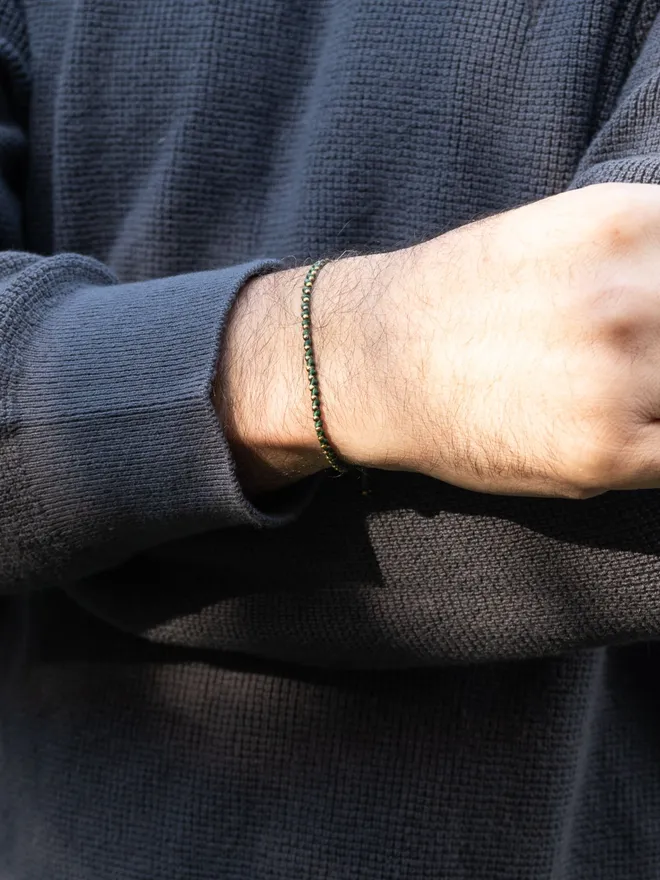 green cord and bronze bracelet for men