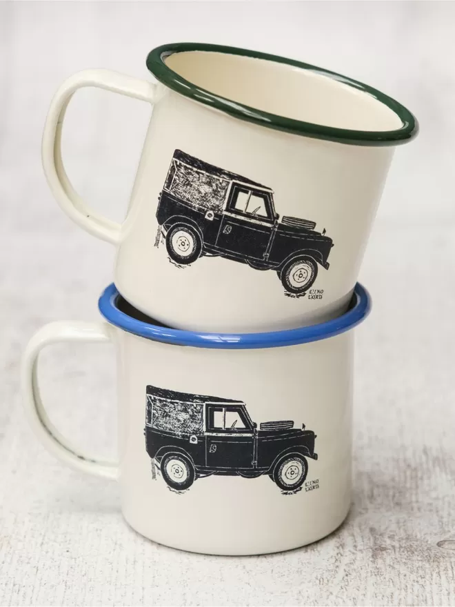 Picture of 2 Cream Enamel Mugs with a Land Rover design etched onto it, taken from an original Lino Print
