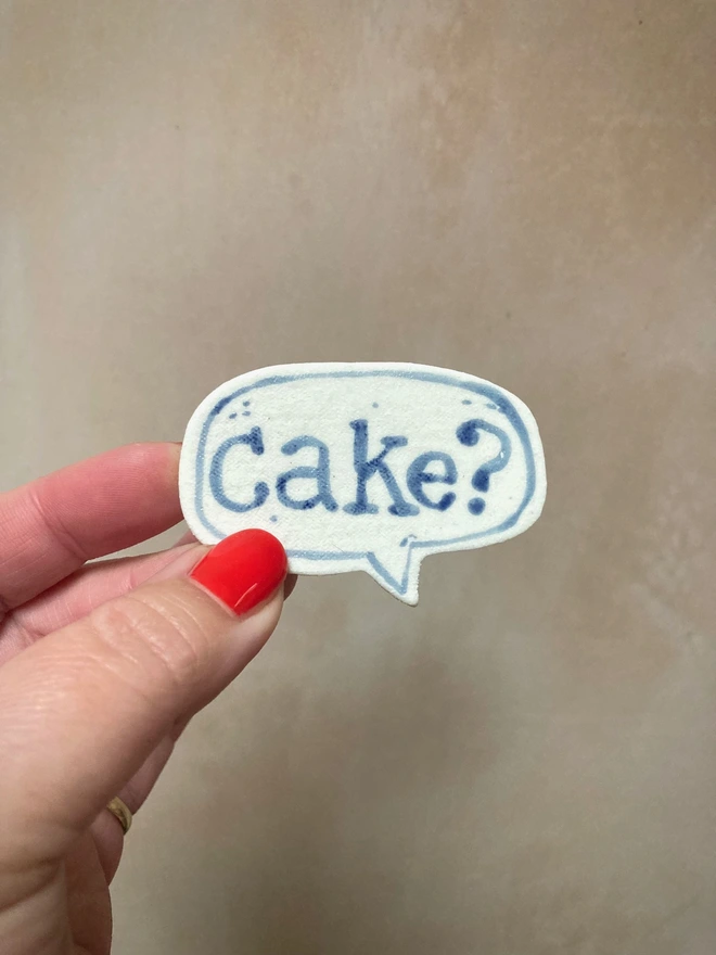 hand painted porcelain blue cake badge brooch