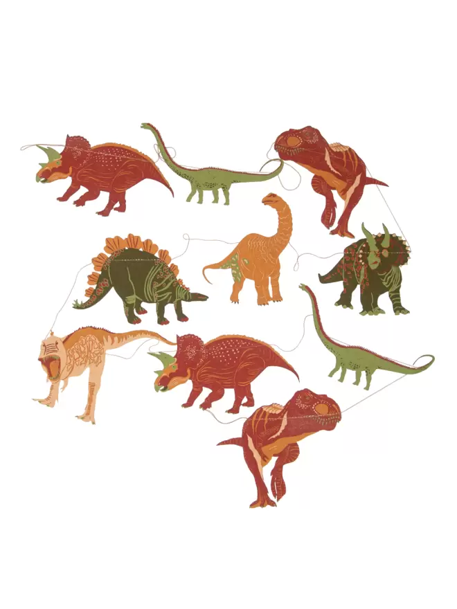 White cut-out of orange, brown and green dinosaurs