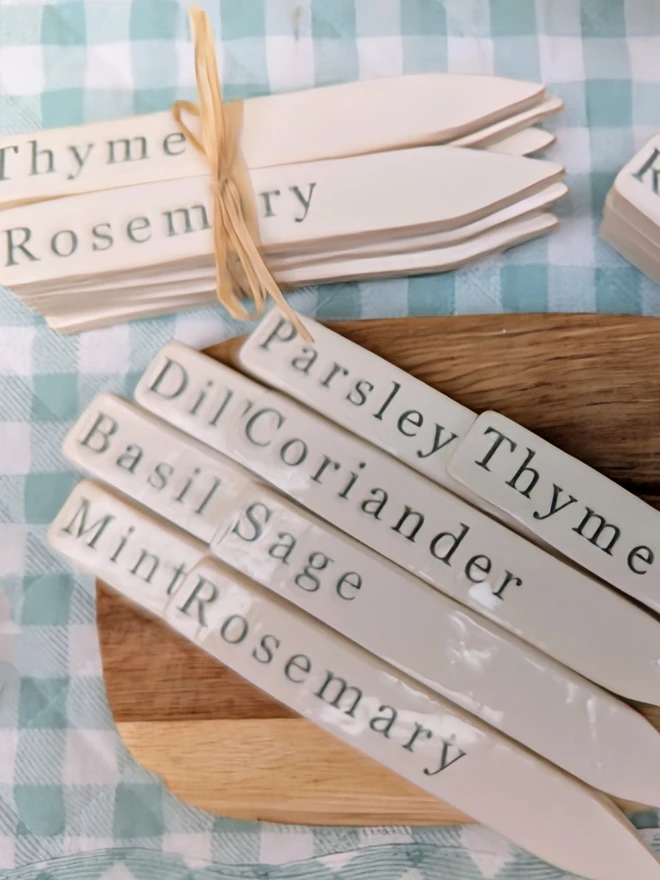 green ceramic herb labels