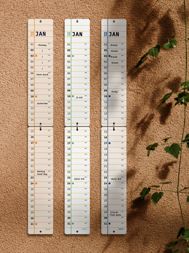 All colours of Squared 2027 Monthly Wall Calendar side by side on brown wall