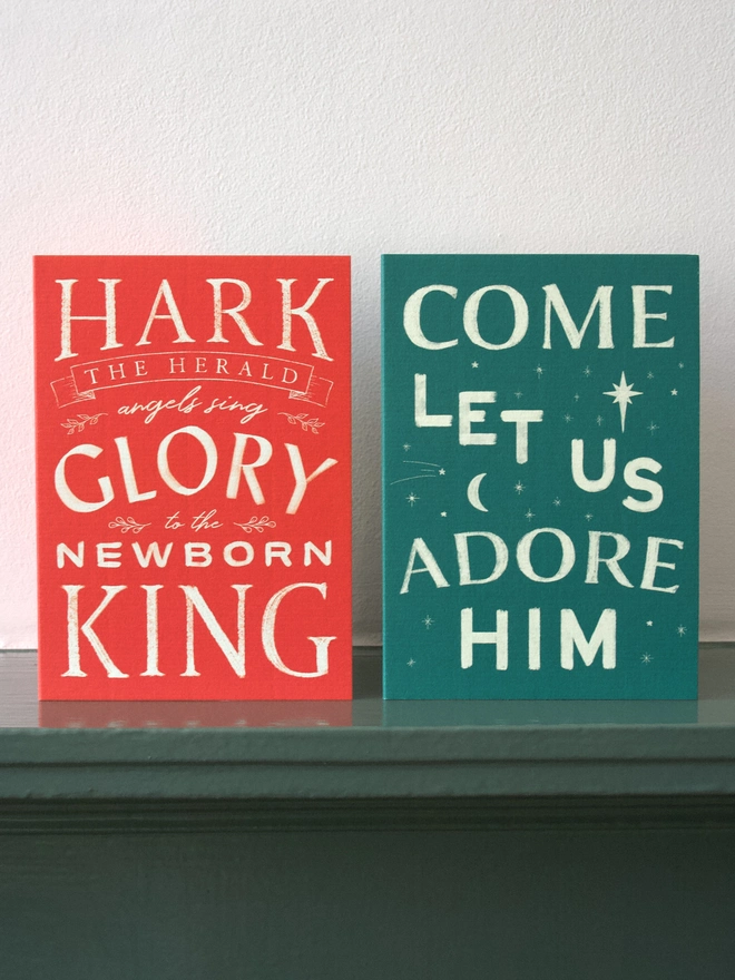 Green Christmas card with carol words from 'O come all ye faithful'