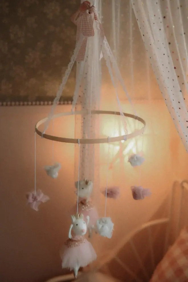 Hanging Mice Ballerina Felt Carousel Decoration, a hanging mice carousel decoration suspended in a child's decorated bedroom. 