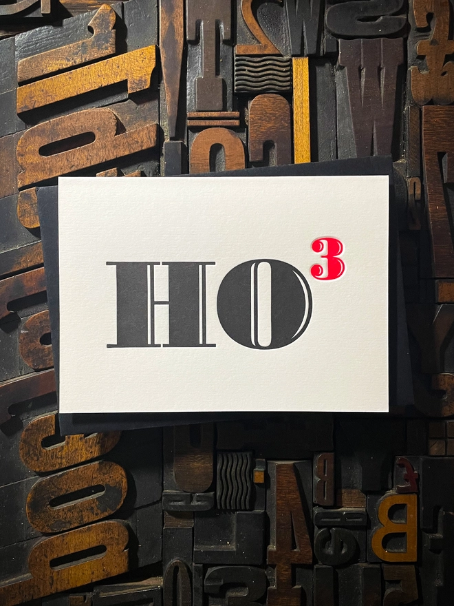 Ho Ho Ho! A beautiful typographic letterpress Christmas card. Printed in rich vibrant red and deep black inks with luxury matching and contrasting envelopes; ideal to send to your designer friends at the festive season.