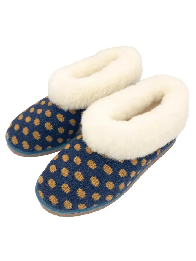 Women's Lambswool & Sheepskin Boot Slippers, a pair of boot slippers sitting on a plain white floor. 