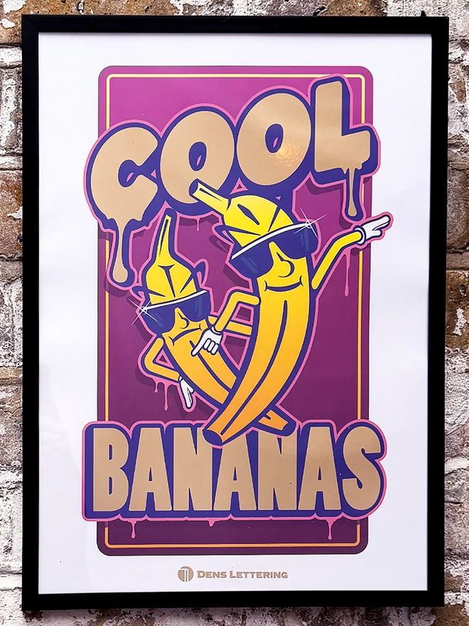 'Cool Bananas' Purple Gold Foil Print on brick wall