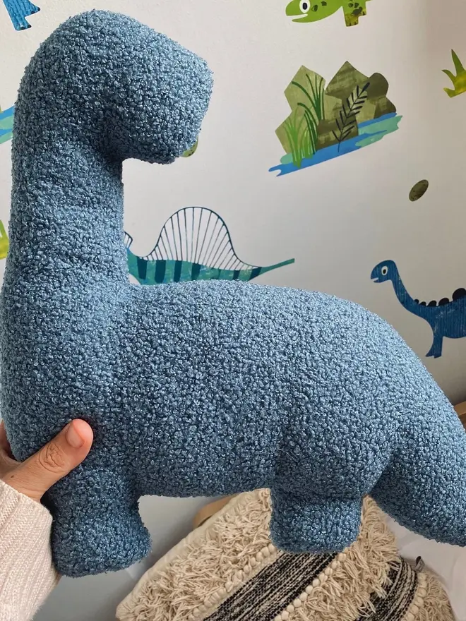 boucle dinosaur pillows. a blue diplodocus cushion.