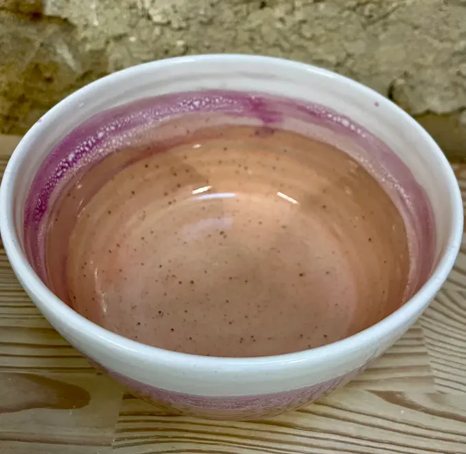 Ice Cream Sundae Ramen Bowl, a colourful ramen bowl sitting on a wooden surface against a brick backdrop. 