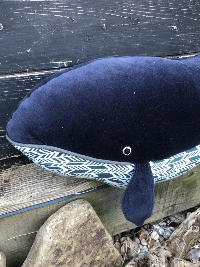 Up close view of dark navy velvet toy handmade seal with 100% printed cotton underbelly 
