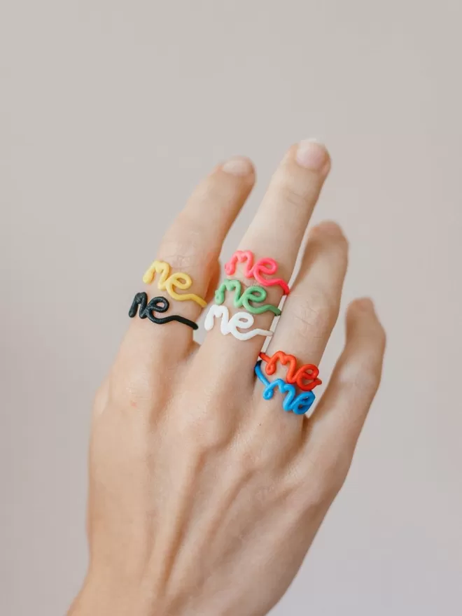 This Is 'Me' Statement Ring seen on a hand.