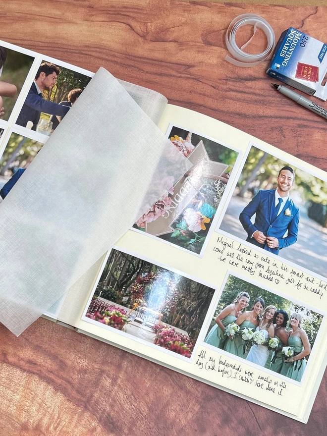 Beautifully Bespoke Large Wedding Album open on a table, filled with photos.