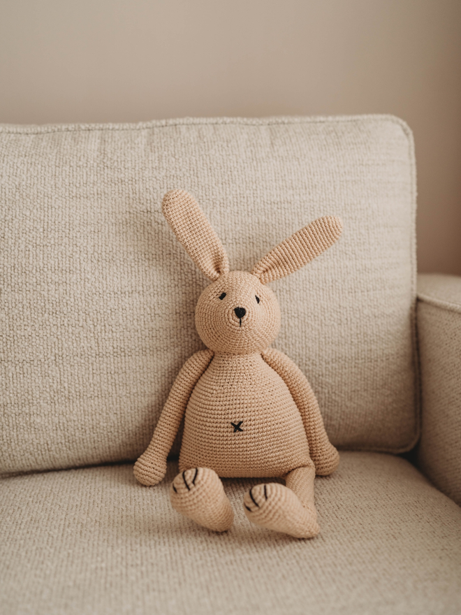 handmade crochet bunny rabbit on sofa