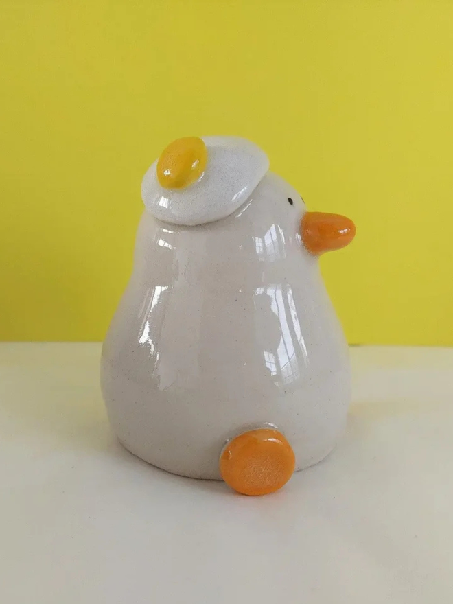 Duck egg head ceramic sculpture