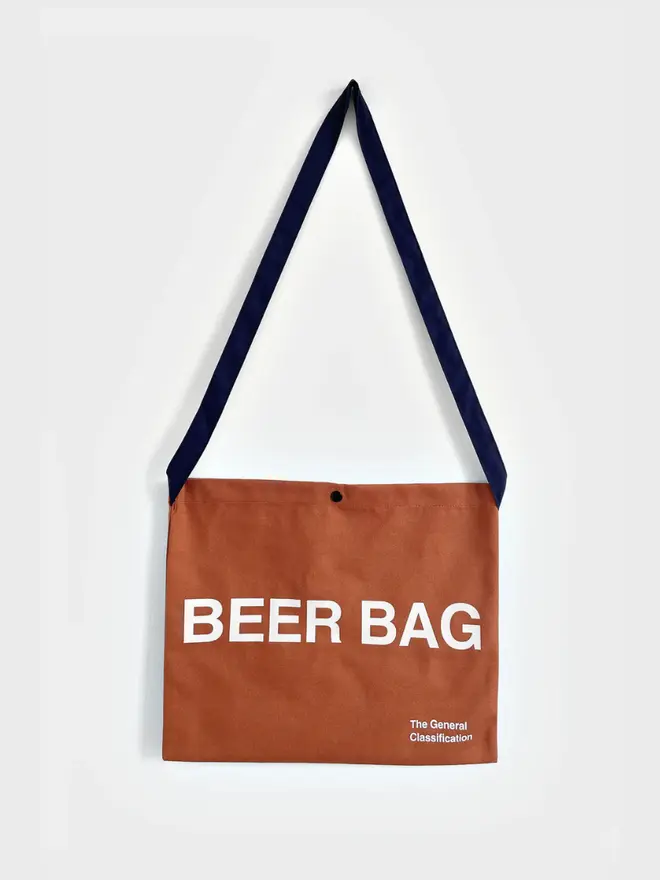 'Beer Bag' Musette Bag, against a grey background. 