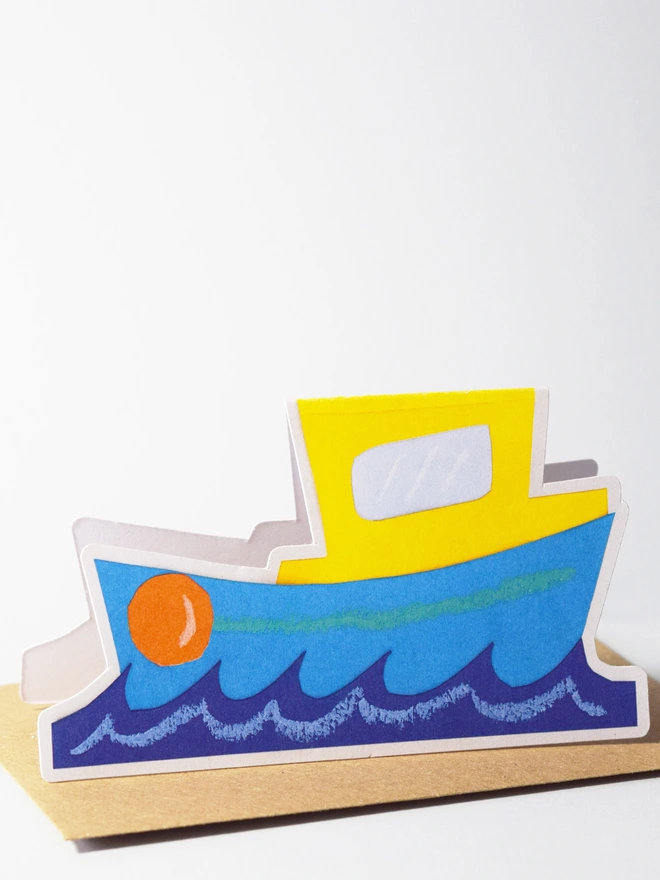 A cut out card of a boat