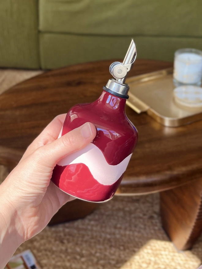 sangria burgundy with pink wave oil bottle