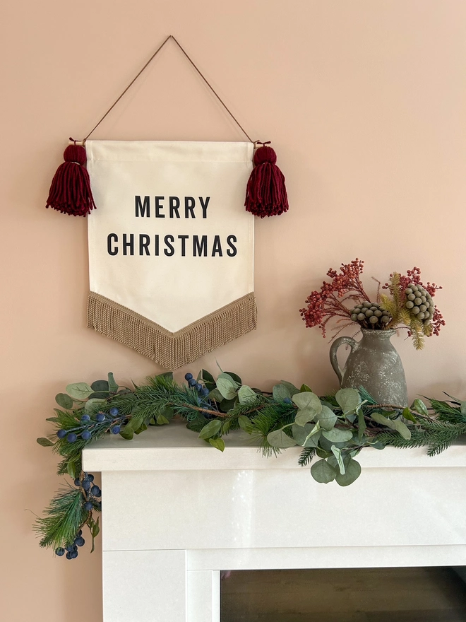 Merry Christmas festive fabric banner decoration with burgundy red yarn tassels and gold bullion trim