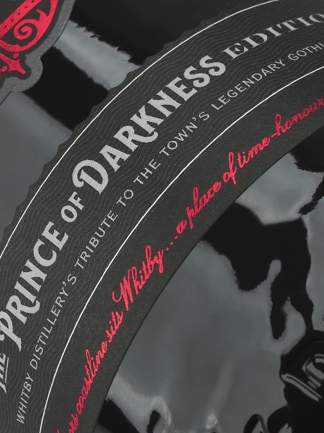 Prince Of Darkness Gin, a bottle of gin sitting on a plain white surface. 