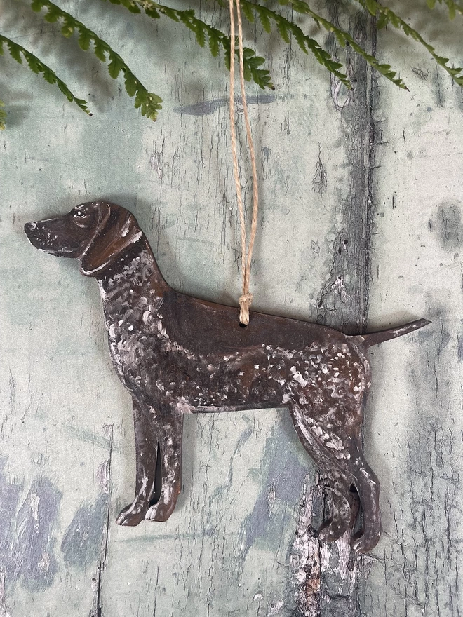 A dog portrait decoration with natural jute twine