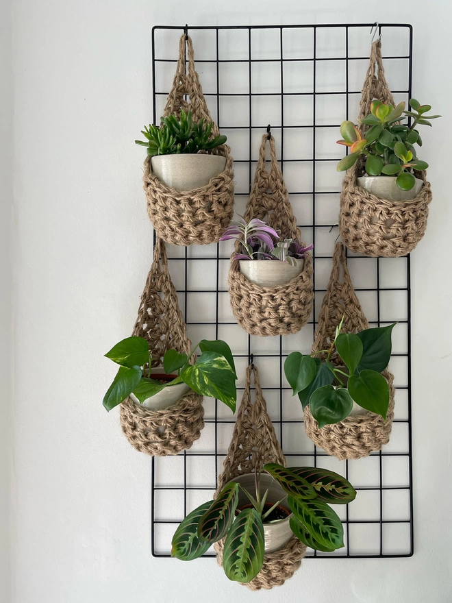 indoor small brown jute hanging wall planter, fabric wall mounted plant holder, handmade crochet plant basket, handmade sustainable crochet decor, rustic natural organic homeware accessories, hanging plant holder
