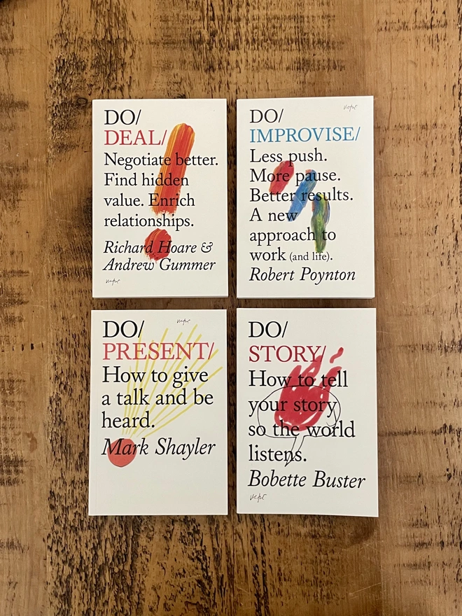 4 books on wooden surface