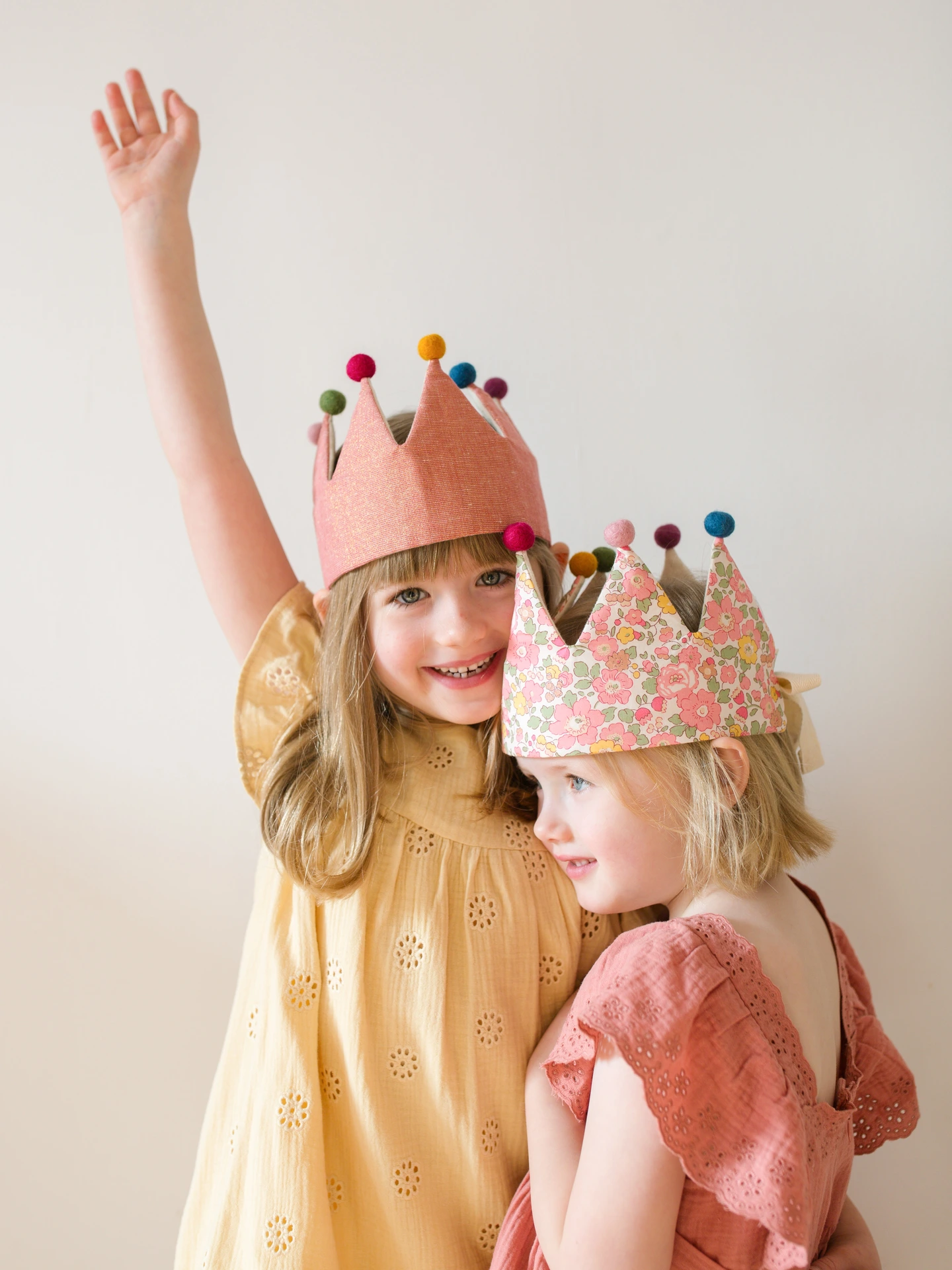 Two girls in their fancy dress crowns