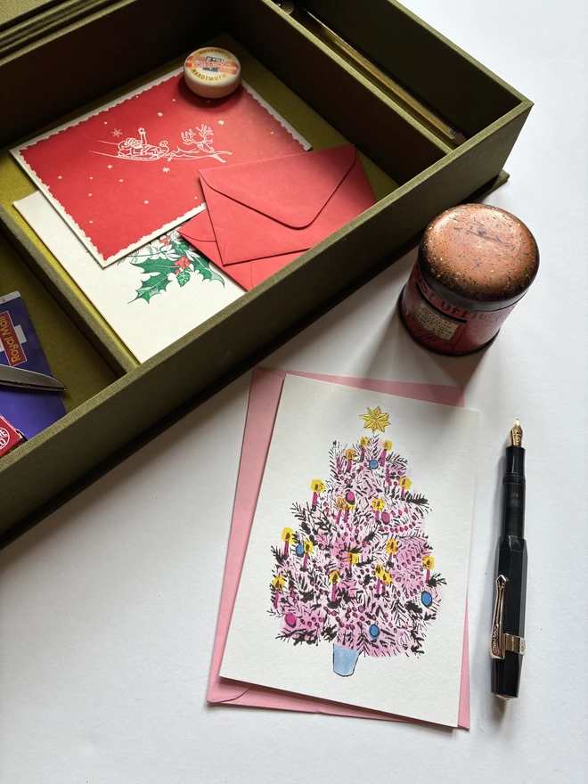 Open handmade Christmas Correspondence box in Olive green cloth displaying cards and stationery items