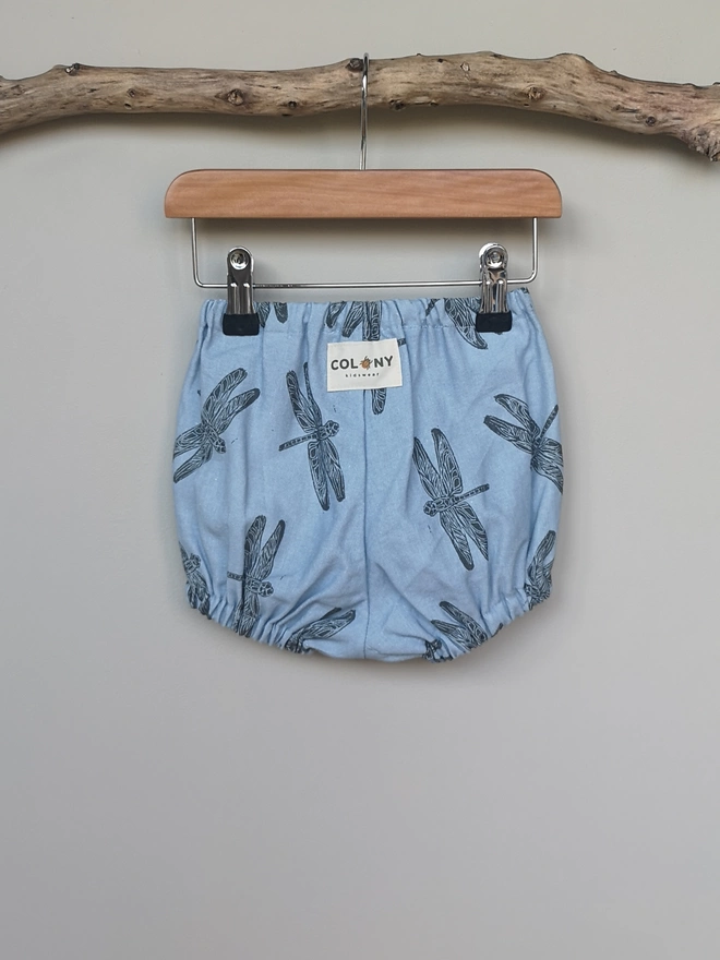 Light Blue Cotton Linen Baby Bloomers. Elasticated waist and leg holes. Featuring a delicate charcoal grey dragonfly print.