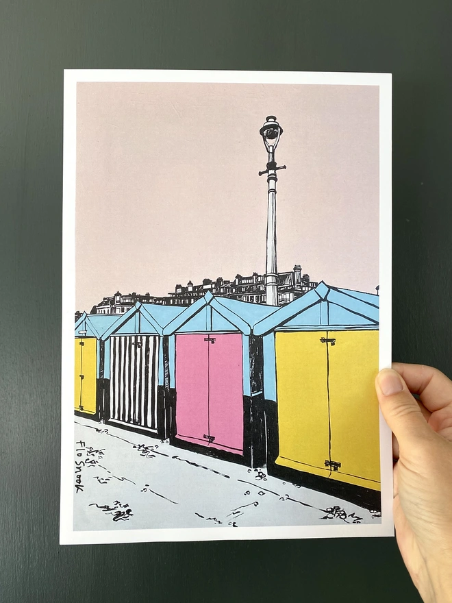 pink and yellow print of brighton hove beach huts