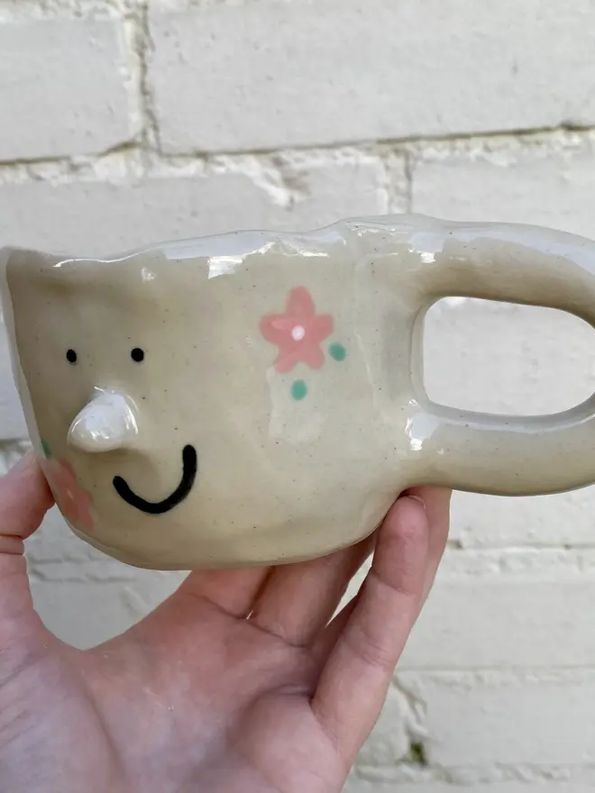 pink flower painted handmade ceramic smiley face mug