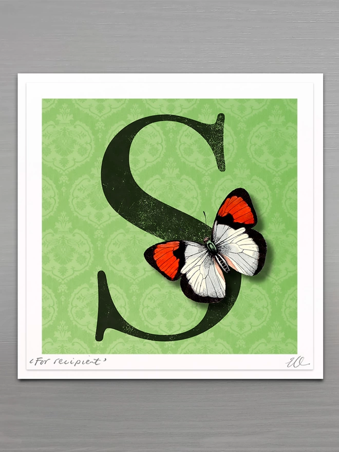 personalised birthday card with large letter on a green coloured patterned background with a 3D paper cut butterfly